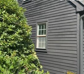 Smooth, fully prepped, and freshly painted wood siding with a clean modern finish.