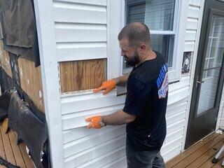 Putting siding back up