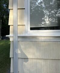 Fully restored, sealed, and freshly painted window sill with complete weatherproofing protection