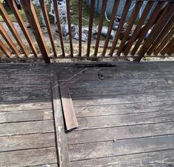 "Identifying severely rotted deck boards and safety hazards before restoration."
