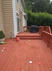 Thorough surface preparation and precision sanding to remove old paint and smooth out rough wood before staining.