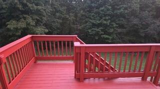 Clean, uniform stain application across deck boards and railings for a flawless, vibrant finish