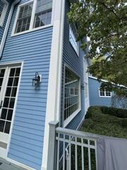 Seamlessly installing fresh, weather-resistant white corner trim to restore structural protection and curb appeal