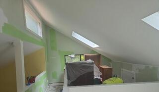 Detailed surface preparation and precise taping for high-angled vaulted ceiling painting in Guilford, CT