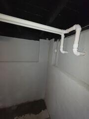 The sump pump in this home will push any water through discharge line and eventually outside of the home entirely. Keeping the space dry and healthy.