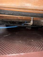 Crawl Space Floor Covered During Vapor Barrier Installation