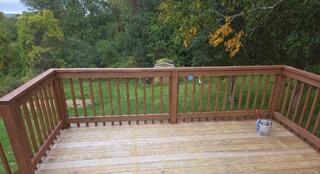 Thorough surface prep and deck cleaning in progress to ensure optimal stain adhesion and long-lasting protection.