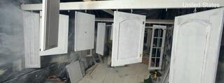 Suspended drying racks allow cabinet doors to dry evenly on both sides without surface contact or blemishes.