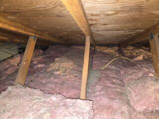 Old Attic Insulated with Fiberglass