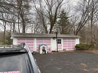 An Aging Garage Roof Ready for Replacement