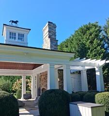 Side Profile Exterior Structure Power Wash - Restoring the bright finish on exterior pillars, trim, and surrounding stone features