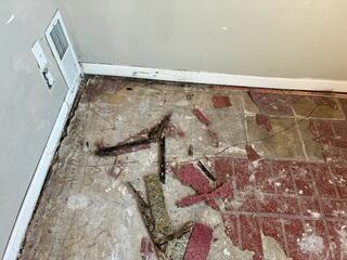 Concrete Floor Crack Near a Room Corner Before Repair