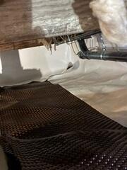 Crawl Space Vapor Barrier Installation in Progress