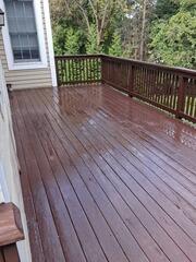 Freshly stained and sealed deck boards offering maximum weather protection and a sleek, rich finish.