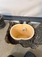 We installed our in-ground sump pump system in this basement. They system collects any water or leaks from the basement and pumps it out of the basement.