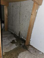 Our sub-floor drainage system was installed at the intersection of the foundation wall and basement floor. This catches leaks like this before they reach the open air of the basement.