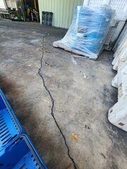Soil settlement beneath the concrete dock had caused the slabs to settle and crack.