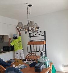 Precision painting around custom cabinetry, light fixtures, and delicate interior trim