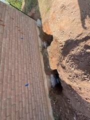 Helical Pier Installation Along the Foundation