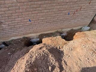 Helical Pier Bracket Beneath the Footing