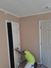 Detailed hand-painting and trim refinishing on interior doors and frames