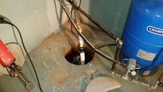 Open, Inefficient Sump Pump 