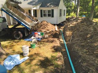 Our installers are trained to use heavy machinery to dig a trench for the drainage line.