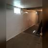 With the drain tile and sump pump in place the final step is to install our CleanSpace membrane along the wall. Not only does this give the wall a bright white clean look, it helps to direct water down the wall into the drain tile and creates a sealed waterproof system for the home. Waterproofing a...