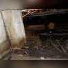 Standing water and muck on the ground and staining on the walls point to longstanding water problems in this crawl space.
