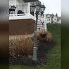 This light post was bent over from wind damage and needed replacement.