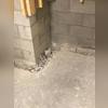 You can see that the installation crew has already started the first step of the WaterGuard installation --chipped away the concrete floor around the perimeter of the basement.