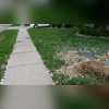 Full view of the old sidewalk before it is repaired.