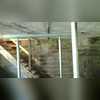 By adding steel beams to the ceiling and supporting them with SmartJack steel posts, the ceiling (and garage floor) are stable and secure.
