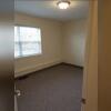 Pictured is one of the bedrooms (each unit has 2) with surface mount lighting on the ceiling.