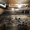 This crawl space is exposed to the earth, making the space unusable to store items in the home.