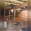 The steel column was assembled and the SmartJack was connected to the beam and tightened. The was fully supported and the floors were even and level again!