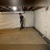 In this photo you can see the progress on the WaterGuard, and the next step: CleanSpace Lining. This is the patent-protected product which will waterproof the walls. This white sheet you see on the back wall is the CleanSpace.