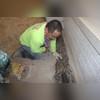 Washed stone is placed on top of the tile to aid in drainage.