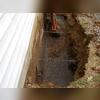 The crews had to dig a hole on the other side of the wall to properly give support.