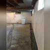 Our team installed our WaterGuard Below-Floor Drain, CleanSpace Wall System Vapor Barrier, and our SaniDry XP Dehumidifier to repair their basement.