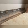 This photo shows after the crew prepped the area for the WaterGuard. The crew then laid the WaterGuard and followed in with crushed drainage stone.