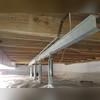 SmartJack crawl space support posts installed to stabilize the sagging floor joists