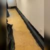 In this photo you can see the crew cut the system and installed it for the best fit. Then they filled in with drainage stone.