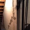 The block foundation wall was covered in leaking stair-step cracks that needed to be filled and stabilize to prevent them from worsening.