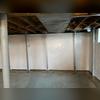 PowerBraces installed to permanently stabilize the bowing basement foundation walls