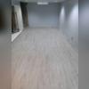 The new flooring looks beautiful in the basement, plus it's waterproof and low-maintenance.
