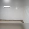 WaterGuard floor drainage system and CleanSpace wall vapor barrier installed to collect water passing through the basement walls and redirect it to a TripleSafe sump pump