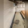 A jackhammer was used to create an interior trench around the basement. We installed a drainage system called WaterGuard XL within the trench, which will catch any water seeping through the porous basement walls and lead it to a sump pump via the WaterGuard XL.