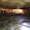 The 6-mil vapor barrier that was originally lining the crawl space floor was ripped in several places, nor was it sealed around all piers and fastened to the foundation walls. The exposed areas allow the earth's moisture to rise into the crawl space and affect the relative humidity and environment...