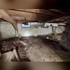 The team finished spraying the crawlspace with Poly.